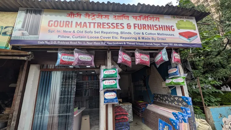 Gouri Mattresses & Furnishing shop front on Pokhran Road No. 1, Vartak Nagar, Thane West, with pillows and mattresses on display