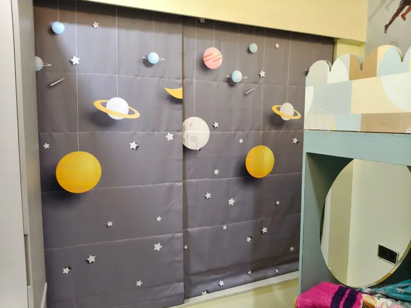 Blackout blinds printed with planets and stars for a child's bedroom in Thane
