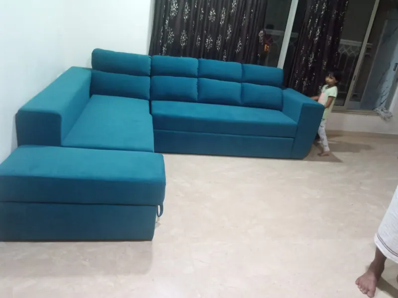 Teal L-shape sofa with a separate storage ottoman, delivered to a Thane flat