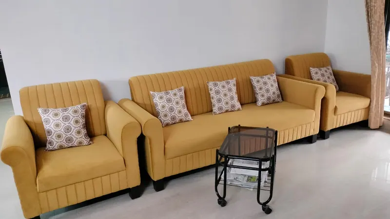 Mustard 3+1+1 sofa set with fluted channel backs and patterned scatter cushions